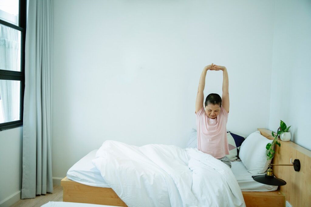 Person sleeping well and waking up refreshed