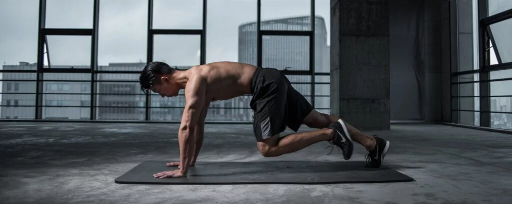 man exercising indoors to improve sleep