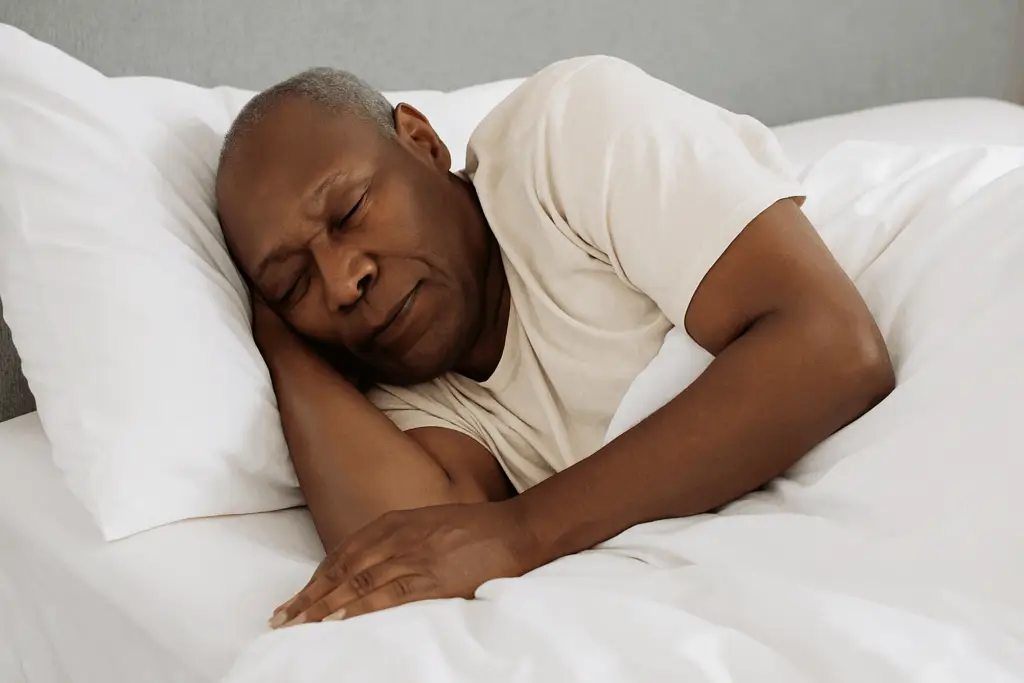 elderly black man sleeping peacefully after cbt sleep therapy from tony ho