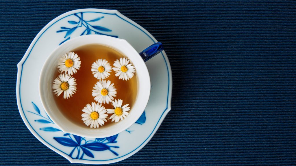 aromatic chamomile tea cup in a saucer