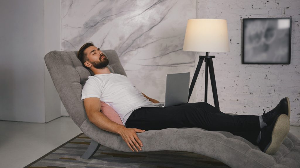 man resting on a lounge chair illustrating mindfulness and relaxation techniques taught in act sleep therapy