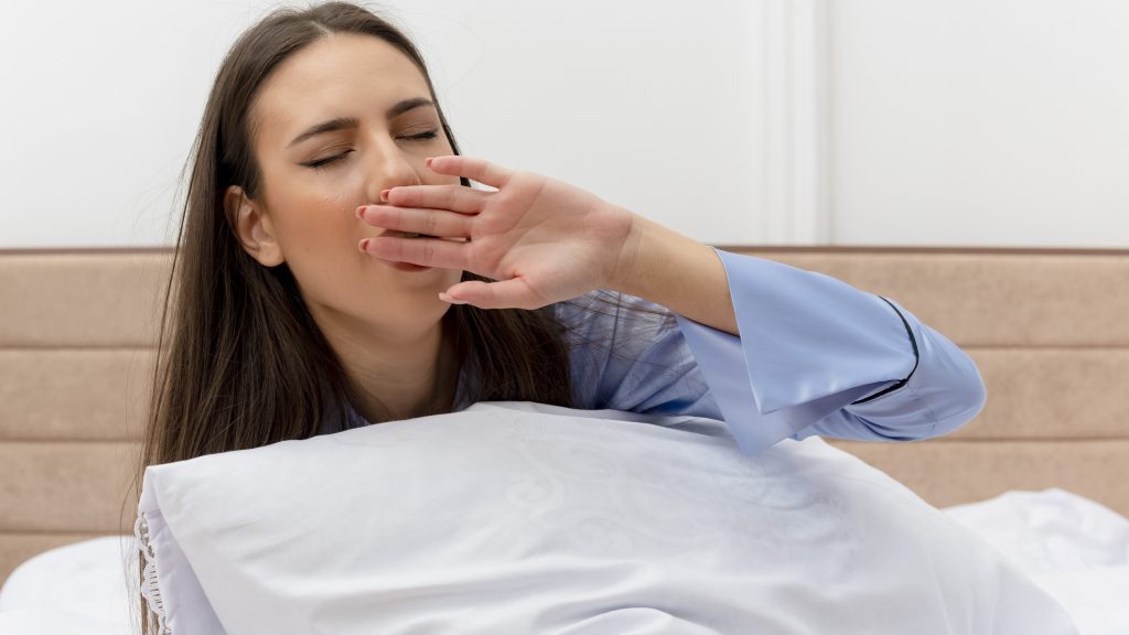 woman experiencing fatigue due to chronic insomnia