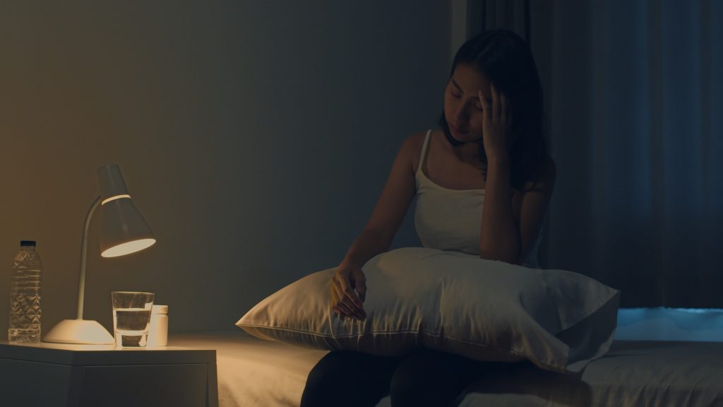 woman experiencing frustration due to a sleepless night